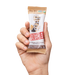 Hand holding Dark Chocolate Chip Peanut Butter bar 